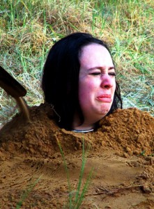 Girl pees on a rock